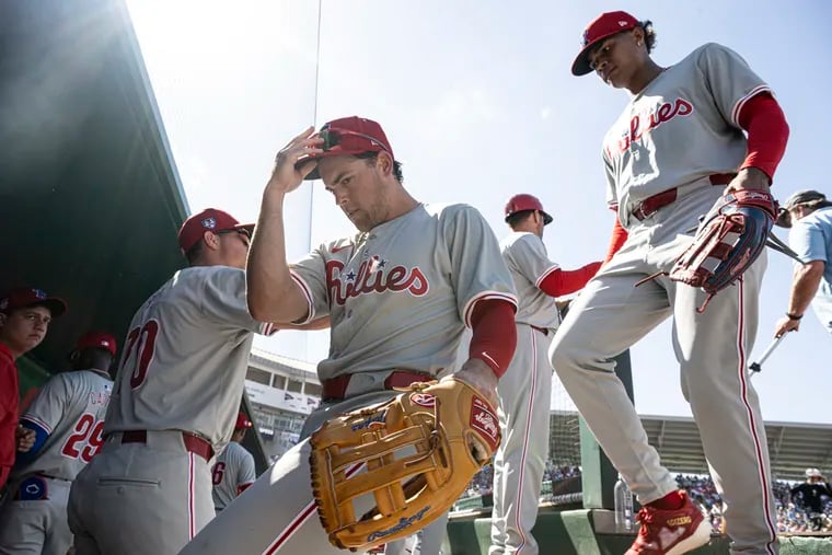 Phillies’ Scott Kingery and Cristian Pache enter the dugout after a game against the Minnesota Twins on Tuesday, Feb.27, 2024 at Lee Health Sports Complex in Fort Myers, FL.