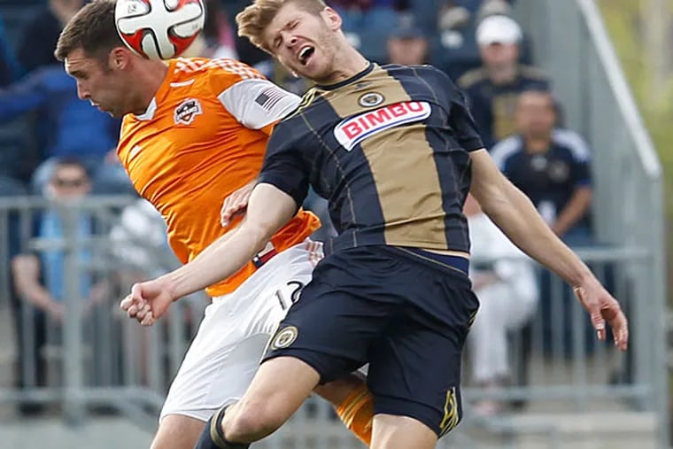 The Union's Aaron Wheeler (right) goes for a header against Houston's Will Bruin. (Ron Cortes/Staff Photographer)