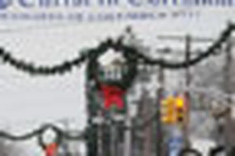 Sign in downtown Pitman on Broadway Avenue near the Broadway Theatre. Sign reads "Keep Christ in Christmas."  December 12, 2011  ( SARAH J. GLOVER / STAFF PHOTOGRAPHER )   EDITOR'S NOTE:   JSIGN13B    A national separation of church and state group is protesting the hanging of a sign in downtown Pitman that reads, "Keep Christ in Christmas."