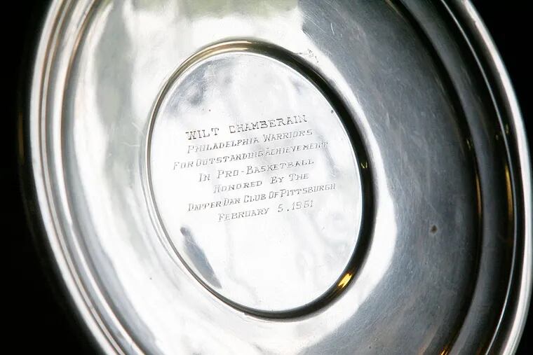 Ronald Toby of Northeast Philadelphia owns a sterling silver plate given years ago to Wilt Chamberlain by the Dapper Dan Club of Pittsburgh.