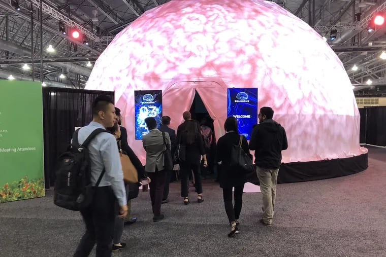 People line up to watch the film inside the BrainDome at the American Academy of Neurology meeting this week at the Pennsylvania Convention Center.