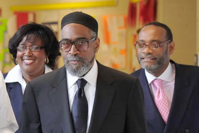 Kenny Gamble, recording industry mogul and founder of Universal Companies, tours Universal Bluford Charter School in 2012.