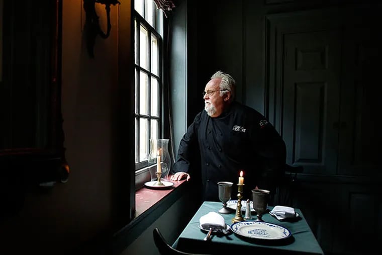City Tavern chef Walter Staib looks out the window next to the George Washington table at the restaurant in Philadelphia on October 17, 2013. ( DAVID MAIALETTI / Staff Photographer )