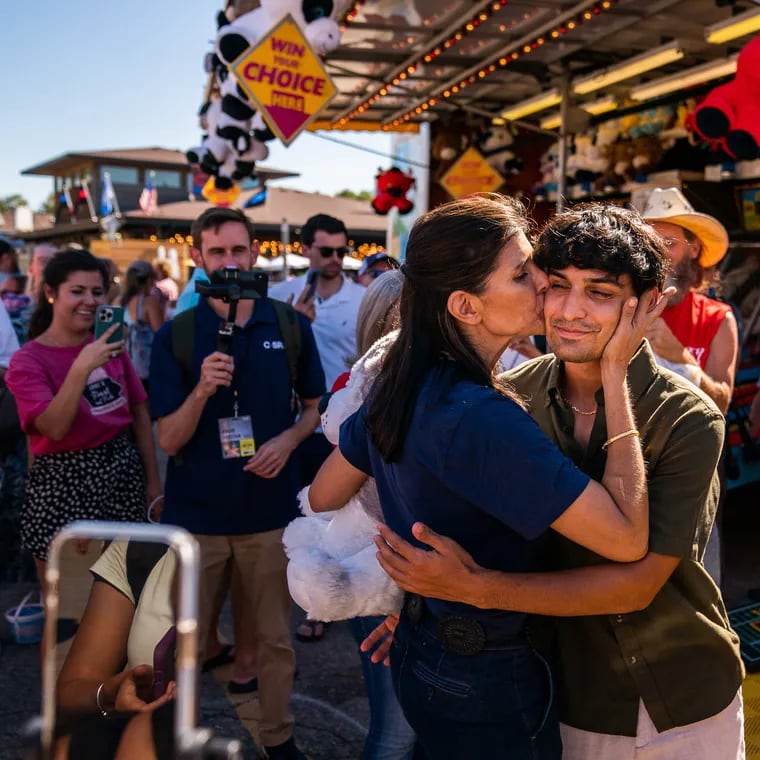 Former South Carolina governor Nikki Haley kisses her son Nalin at the Iowa State Fair Grounds on Aug. 12.