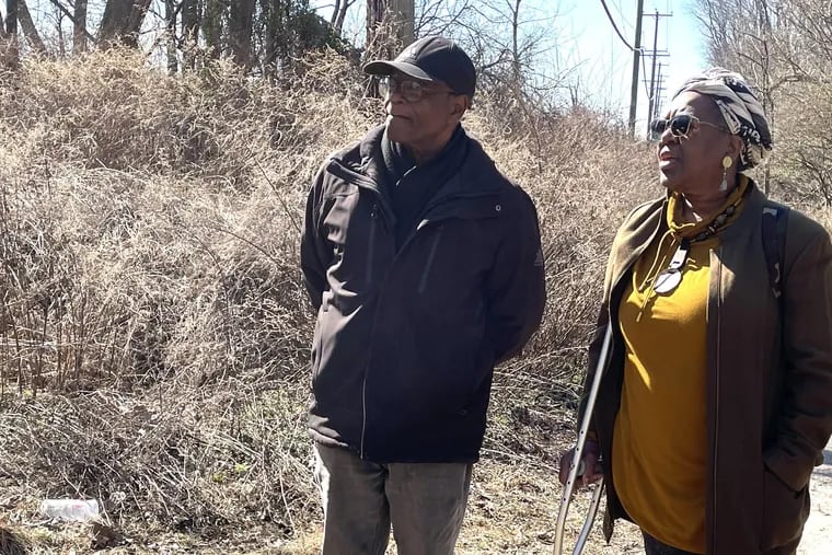 Ferdinand Morrison and Deborah Gary at the site of what once was the Byberry Township African American Burial Ground. Their organization, the Society to Preserve Philadelphia African American Assets, is one of several groups hoping to clean up and preserve the cemetery.