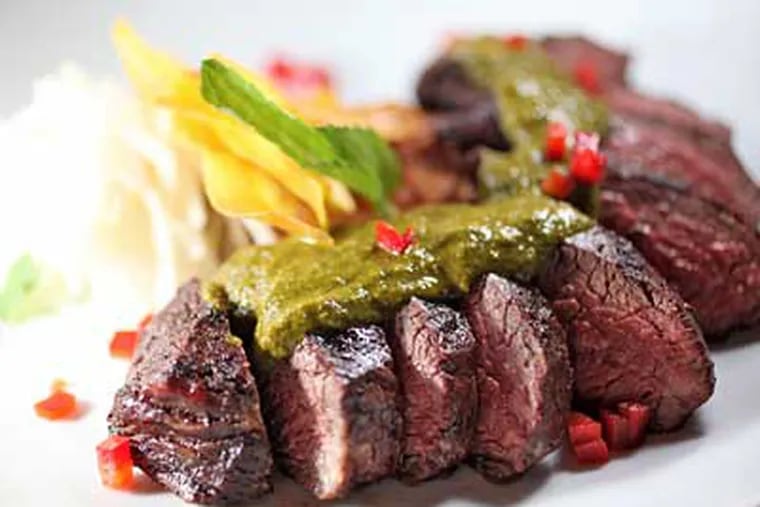 Entrees such as the chimichurri-covered hanger steak appeal to a neighborhood crowd eager for better dining on Germantown Avenue. (DAVID M WARREN / Staff Photographer)