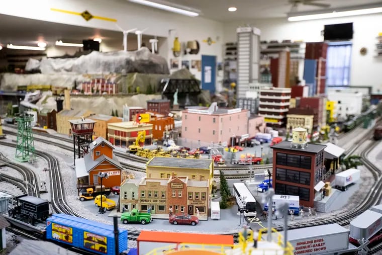 The four storefront building (center) in Phil Haile's model train layout was built by his father in the 1930s. After adding on for years, Phil Haile has decided this is last year he will invite visitors to their Chalfont garage at Christmastime to see the trains.