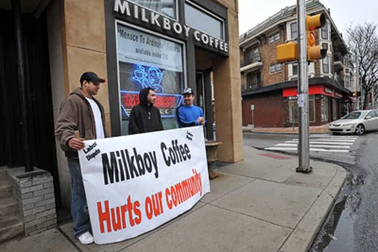 At MilkBoy Coffee in Ardmore, Local 8 Carpenters Union members Greg Scirrotto (left), Bill Strassheim and Mike Mehalchick are protesting because the cafe's owners are using non-union workers at their new site in Center City. (Sharon Gekoski-Kimmel / Staff Photographer)