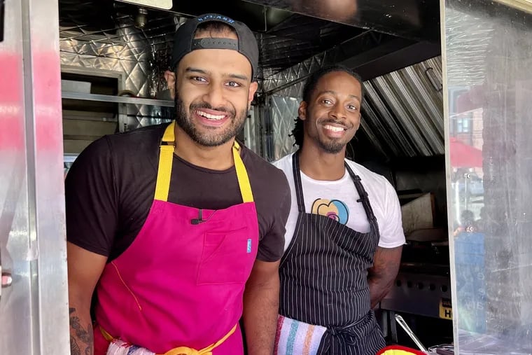 Chef Reuben Asaram (left), who goes by Chef Reuben, and chef Cory Powell, of Make'm Bake'm, at a pop-up event at Herman's Coffee on Sept. 2, 2022.