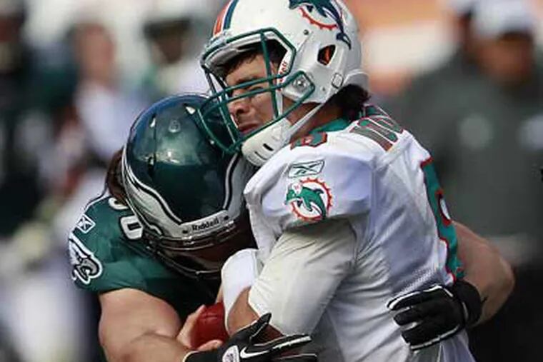 Eagles linebacker Casey Matthews sacks Dolphins quarterback Matt Moore during the second quarter. (David Maialetti/Staff Photographer)