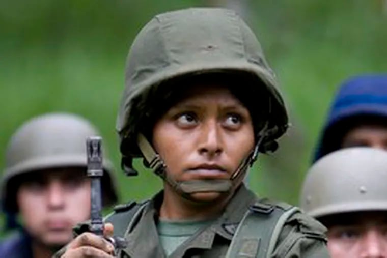 A cadet holds her position. Women now may train to become engineers, pilots - even, ultimately, generals.