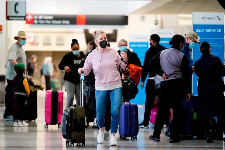 Travelers at Philadelphia International Airport on April 19, 2022.