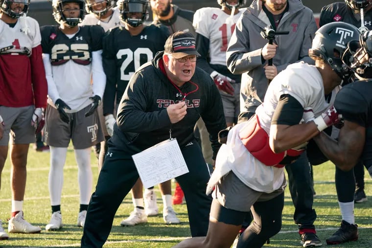 Ed Foley, interim head coach, works with the players during Temple's practice on Monday. JESSICA GRIFFIN / Staff Photographer