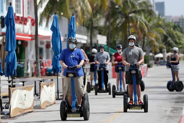 A tour group riding Segways rode down Miami Beach, Florida's famed Ocean Drive on South Beach, on July 4.