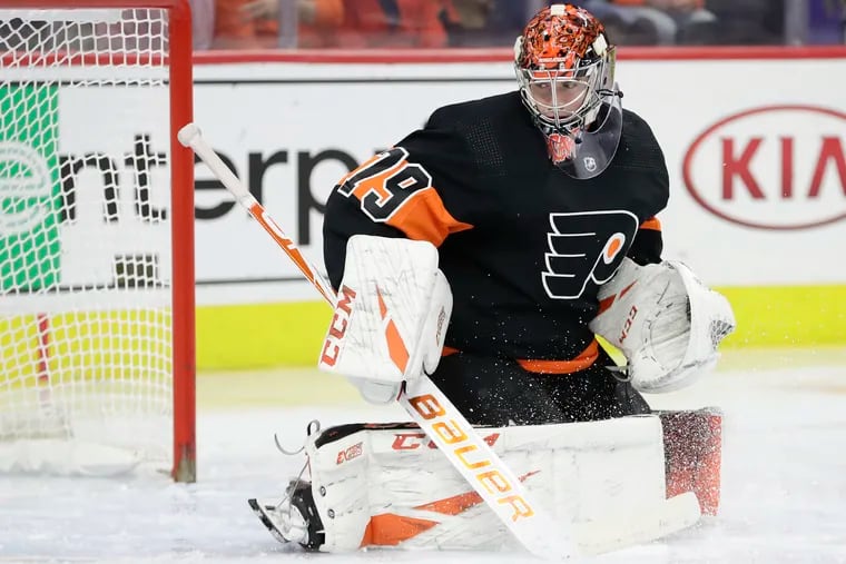 Flyers goaltender Carter Hart warms up before a Dec. 23 game against the New York Rangers. He'll be making his playoff debut when the season returns.