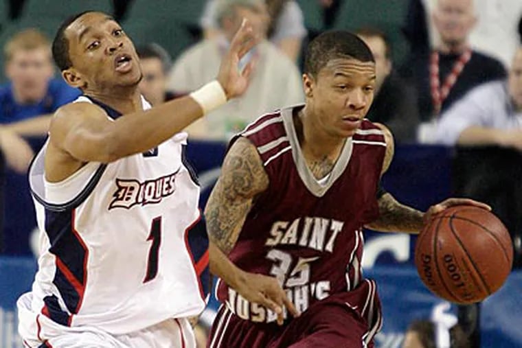 Saint Joseph's advanced to the semifinals of the Atlantic Ten Tournament with a win over Duquesne. (Yong Kim/Staff Photographer)