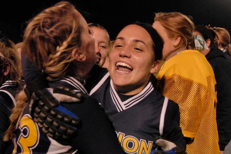 Merion Mercy&#0039;s Allison Moran (center) embraced Molly Doyle after a 1-0 win over Christopher Dock last month.