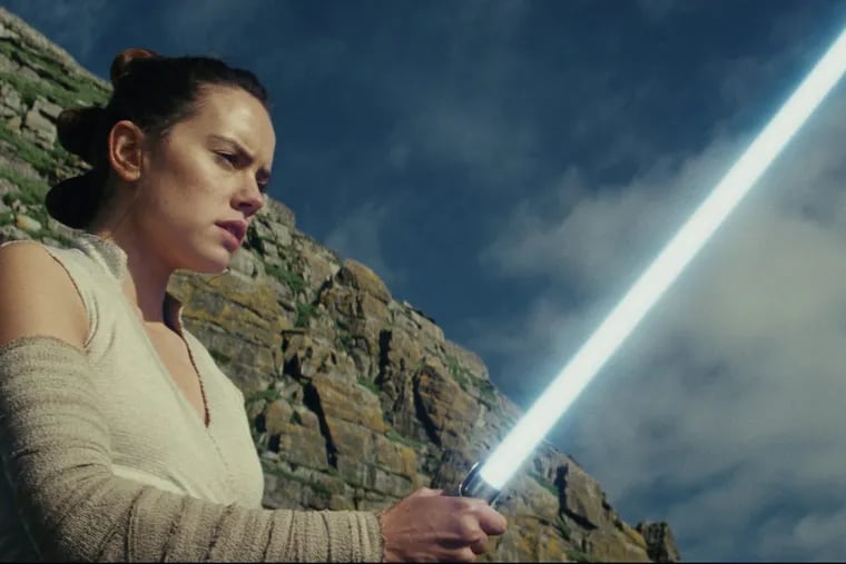 This image released by Lucasfilm shows Daisy Ridley as Rey in “Star Wars: The Last Jedi.”