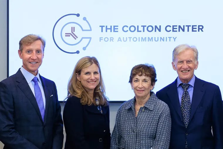 Philanthropists Judith and Stewart Colton (right) gave $50 million to the University of Pennsylvania for the study of autoimmune diseases. At left are Penn medical school dean J. Larry Jameson and university president Liz Magill.