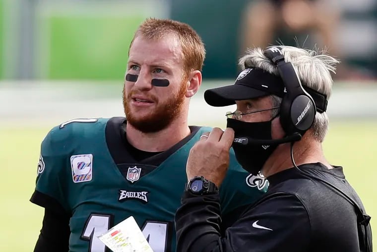 Carson Wentz with Doug Pederson during Sunday's game against Baltimore.