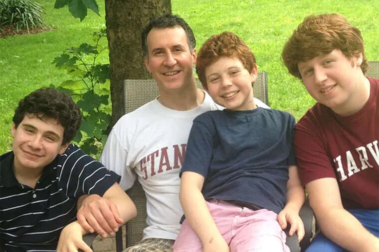 Michael Zinn with sons (from left) Jonah, Danny, and Sam