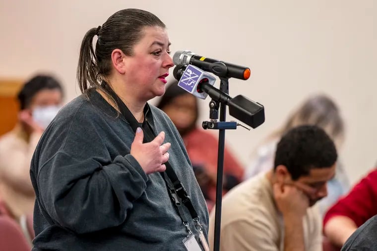 NJ Transit rider Elizabeth Zerambo speaks during a public hearing at the Cherry Hill Library. Zerambo complained about the number of people who board buses without paying their fare, which made her feel unsafe.