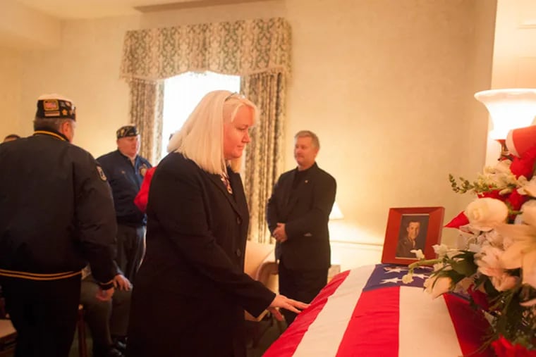 Megan Smolenyak pays respects to Staff Sgt. Zoltan Dobovich. (Ed Hille / Staff Photographer)