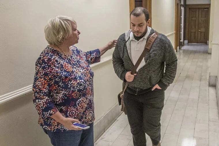 Calvin S. Turner IV, grandson and heir of radio icon Mary Mason, is greeted by his mother, Carla James, outside Courtroom E in the Montgomery County Courthouse.