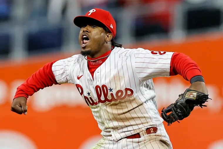Phillies second baseman Jean Segura flexes after making a dazzling defensive play on a ball hit by Padres shortstop Ha-Seong Kim in the seventh inning.