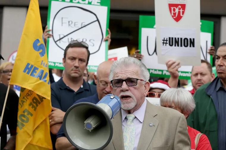 Patrick J. Eiding, center, President of the Philadelphia Council AFL-CIO, speaks during a union rally outside Federal Court in Philadelphia in June.
