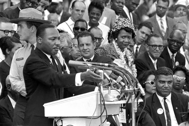 FILE - The Rev. Dr. Martin Luther King Jr., delivers his "I Have a Dream" speech in Washington, Aug. 28, 1963, as National Park Service ranger Gordon "Gunny" Gundrum, left, stands beside King. (AP Photo/File)