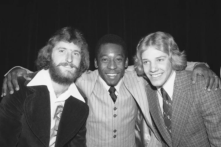 Soccer star Pelé poses in New York with the newest additions to the New York Cosmos on Jan. 6, 1976. Bob Smith, left, and Bob Rigby, both formerly of the Philadelphia Atoms, had just signed with the Cosmos.