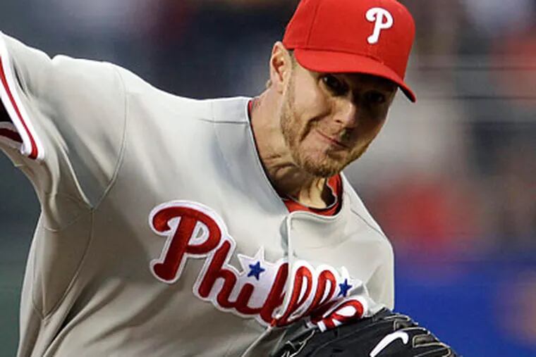 Roy Halladay suffered his first loss of the season against the Giants. (Marcio Jose Sanchez/AP)