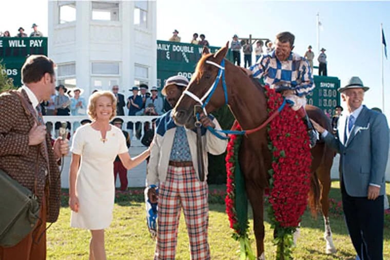 From left: Diane Lane, Nelsan Ellis, Otto Thorwarth, and John Malkovich are shown in a scene from, "Secretariat." Lane plays the stallion’s owner, Malkovich its trainer.