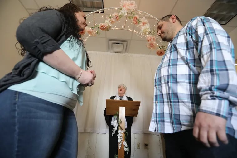 Joanne Schwartz, the new Burlington County clerk, officiates the wedding of Elizabeth and Joseph Homen in a conference room at her office in Mt. Holly on Tuesday.