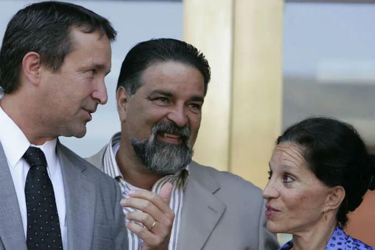 Renee Tartaglione Matos with husband (center) and lawyer. She denies claims that she's planning a run for City Commissioner. (File photo)