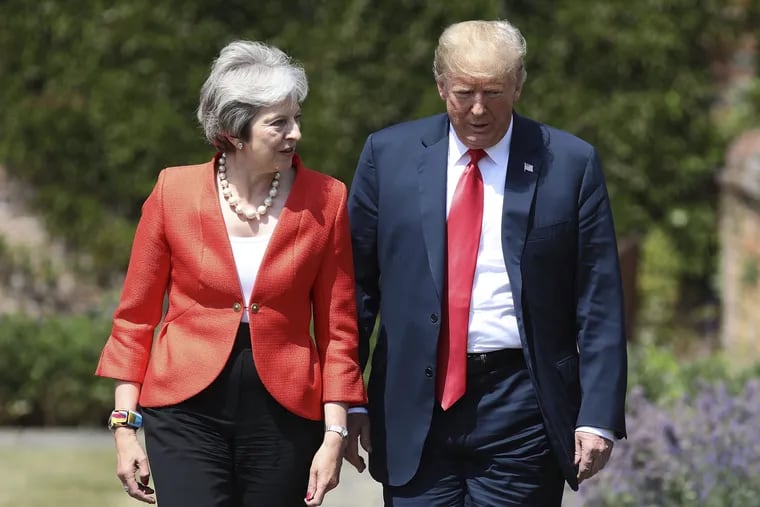 British Prime Minister Theresa May walks with U.S President Donald Trump prior to a joint press conference at Chequers, in Buckinghamshire, England, Friday, July 13, 2018. Despite controversial remarks from Trump, the two leaders praised each other following what seemed to be an amicable meeting.