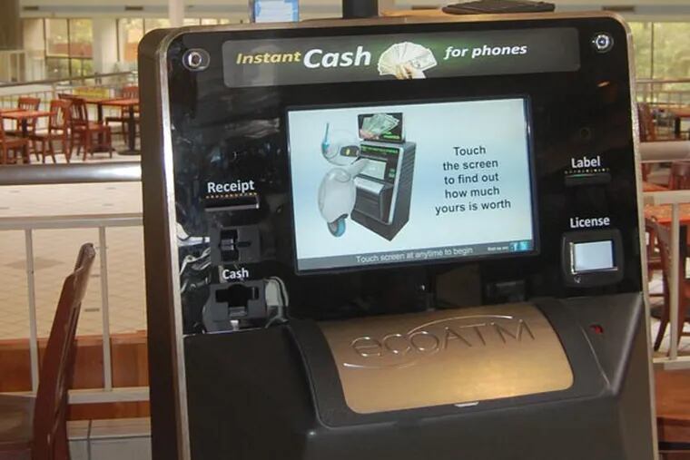 This undated photograph provided by ecoATM, shows the EcoATM, which is a cupboard-sized machine with a big touch screen and a big metal ìmouthî where you can place your old phone or MP3 player. Its analysis complete, it gives you a quote on the spot, based on what a network of hundreds of electronics-recycling companies are willing to pay for it. If you accept, it spits out cash. (AP Photo/ecoATM)