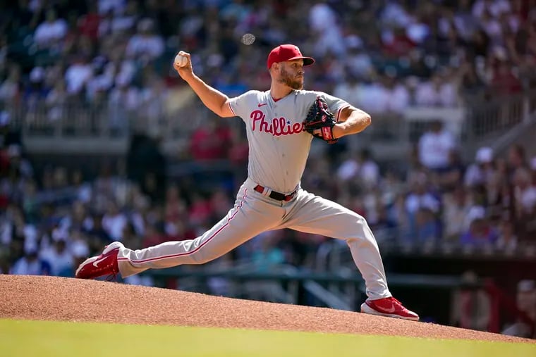 Philadelphia Phillies starting pitcher Zack Wheeler (45) delivers in the first inning of a baseball game against the Atlanta Braves, Saturday, May 27, 2023, in Atlanta. (AP Photo/Brynn Anderson)