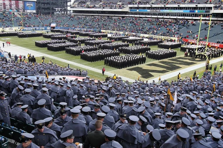 Navy midshipmen take part in the “March On” before the start of the 2013 game at the Linc. Where else can you see a tradition like this?