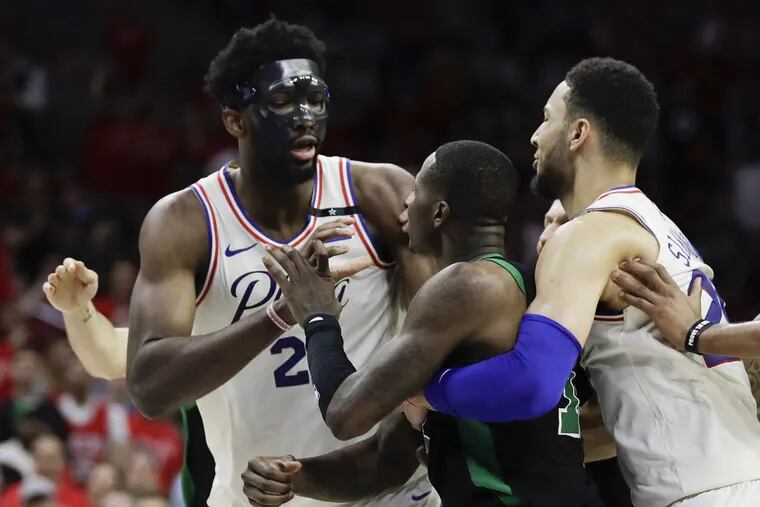 Sixers center Joel Embiid and Boston Celtics guard Terry Rozier get into a second-quarter altercation during Game 4 of the Eastern Conference semifinals on Monday, May 7, 2018 in Philadelphia.