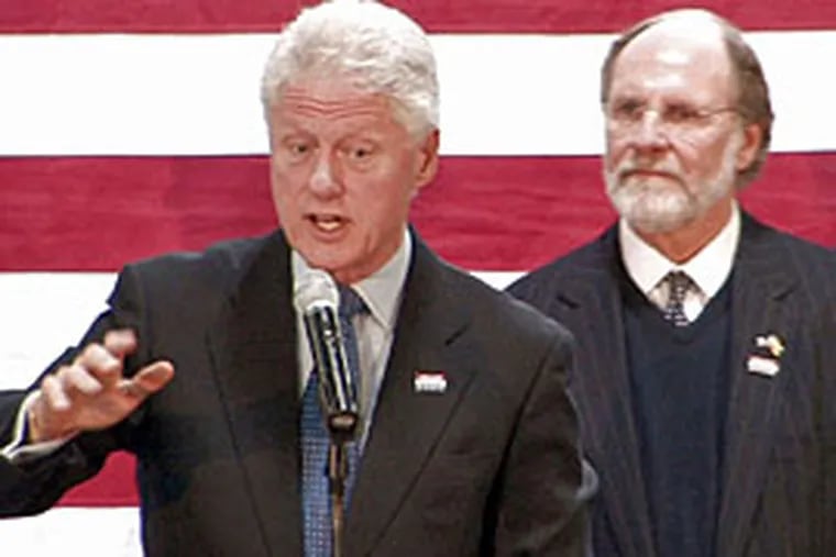 Bill Clinton, flanked by NJ Gov Corzine, stumps for his wife at Camden County College.  (David Swanson/Inquirer)