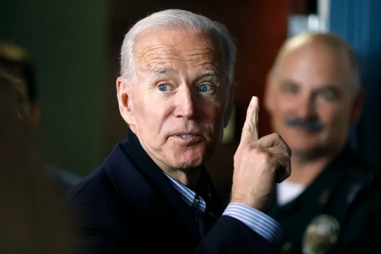 In this May 13, 2019, photo, former vice president and Democratic presidential candidate Joe Biden interacts with a supporter during a campaign stop at the Community Oven restaurant in Hampton, N.H.