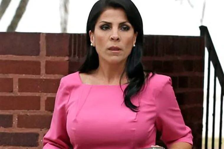 In this Nov. 13, 2012, file photo, Jill Kelley leaves her home in Tampa, Fla. South Korea will revoke an honorary title given to the American socialite tied to the scandal involving former CIA director David Petraeus, officials said Tuesday, Nov. 27, 2012. (AP Photo/Chris O'Meara, File)