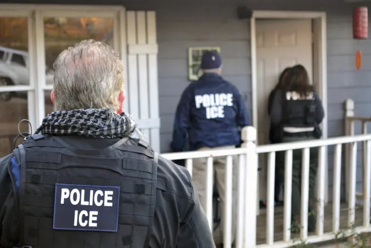 U.S. Immigration and Customs Enforcement agents at a home in Atlanta  during a targeted enforcement operation in 2017.
