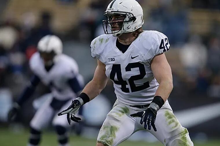 Penn State linebacker Michael Mauti was the only players in the top 10 in the conference in tackles, interceptions, and forced fumbles. (Darron Cummings/AP)