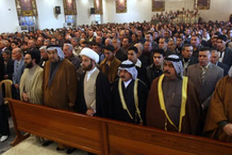 Shiite tribal leaders attend Christmas Mass at an Assyrian Orthodox church in Baghdad. The church, which is next to a Shiite mosque, hosted Muslim neighbors for the Mass as a gesture of friendship.