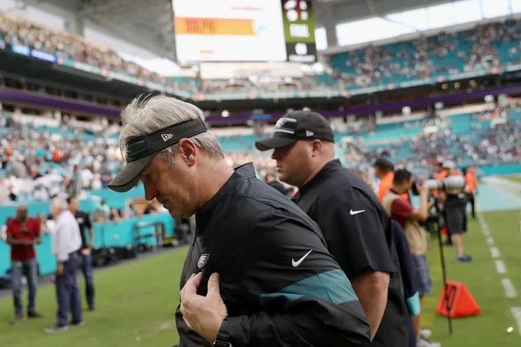 Eagles head coach Doug Pederson leaves the field after the loss to the Dolphins.