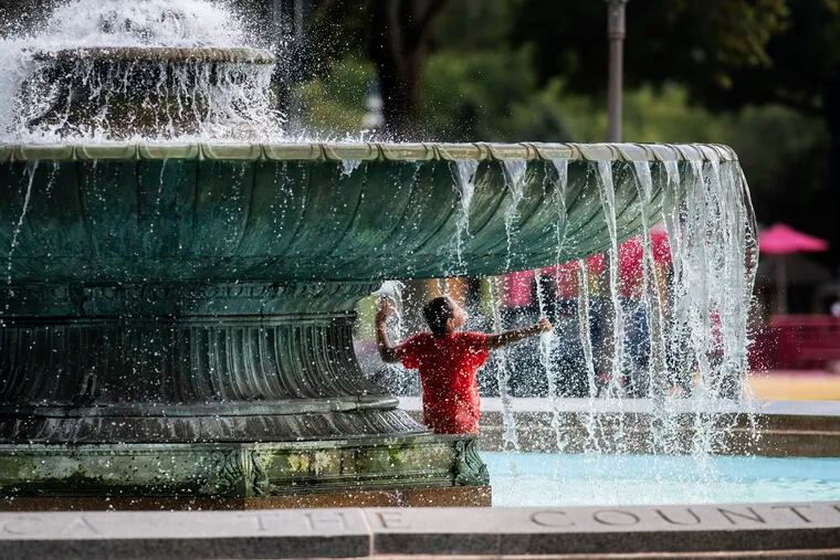 Amid a heatwave in Philadelphia, Alex Paladino cools off at the Eakins Oval fountain.