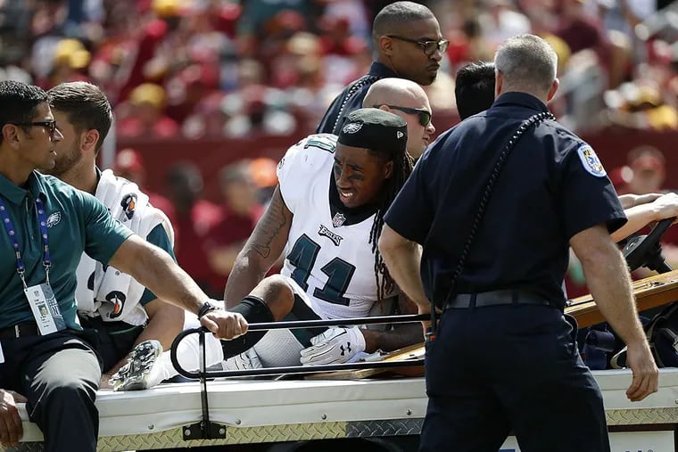 Philadelphia Eagles cornerback Ronald Darby rides a cart off the field after being injured in the first half of an NFL football game against the Washington Redskins, Sunday, Sept. 10, 2017, in Landover, Md.